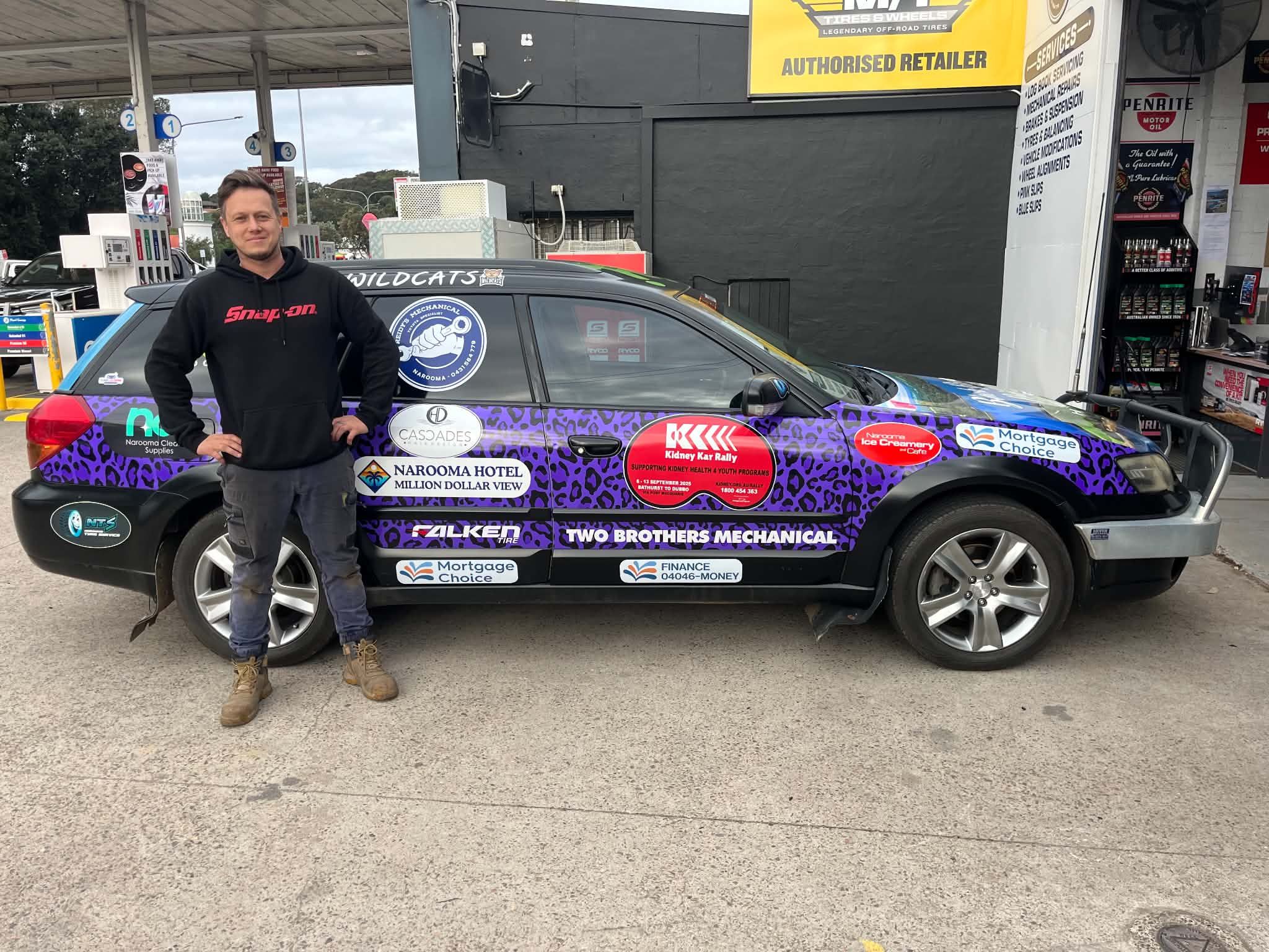 The Kidney Kar Rally charity car carrying the Reidy's Mechanical logo, on the workshop forecourt