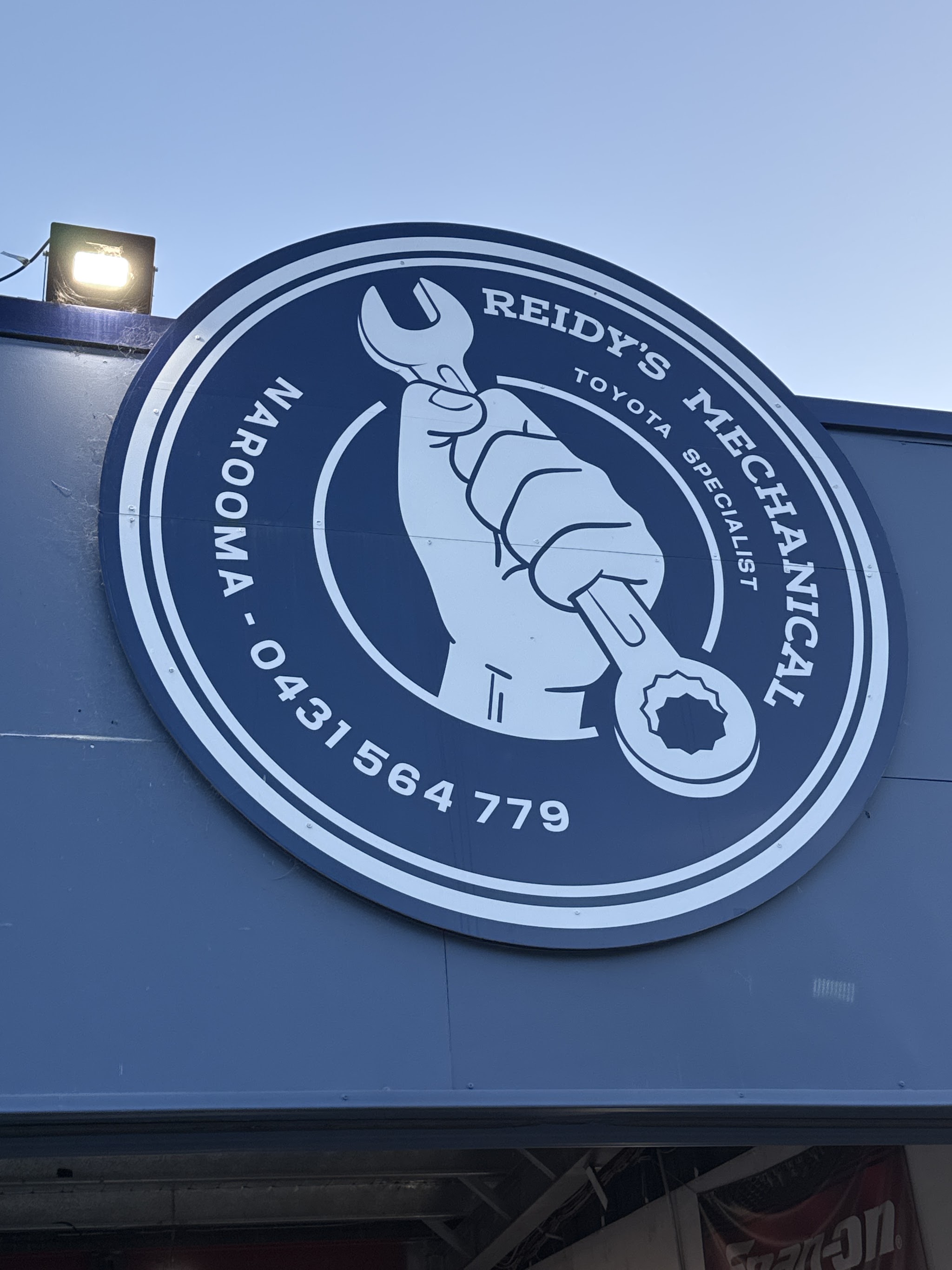 The Reidy's Mechanical roundel sign mounted on the workshop
